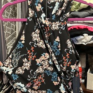Rachel Roy black with peach/blue/rose flower pattern.  Size M